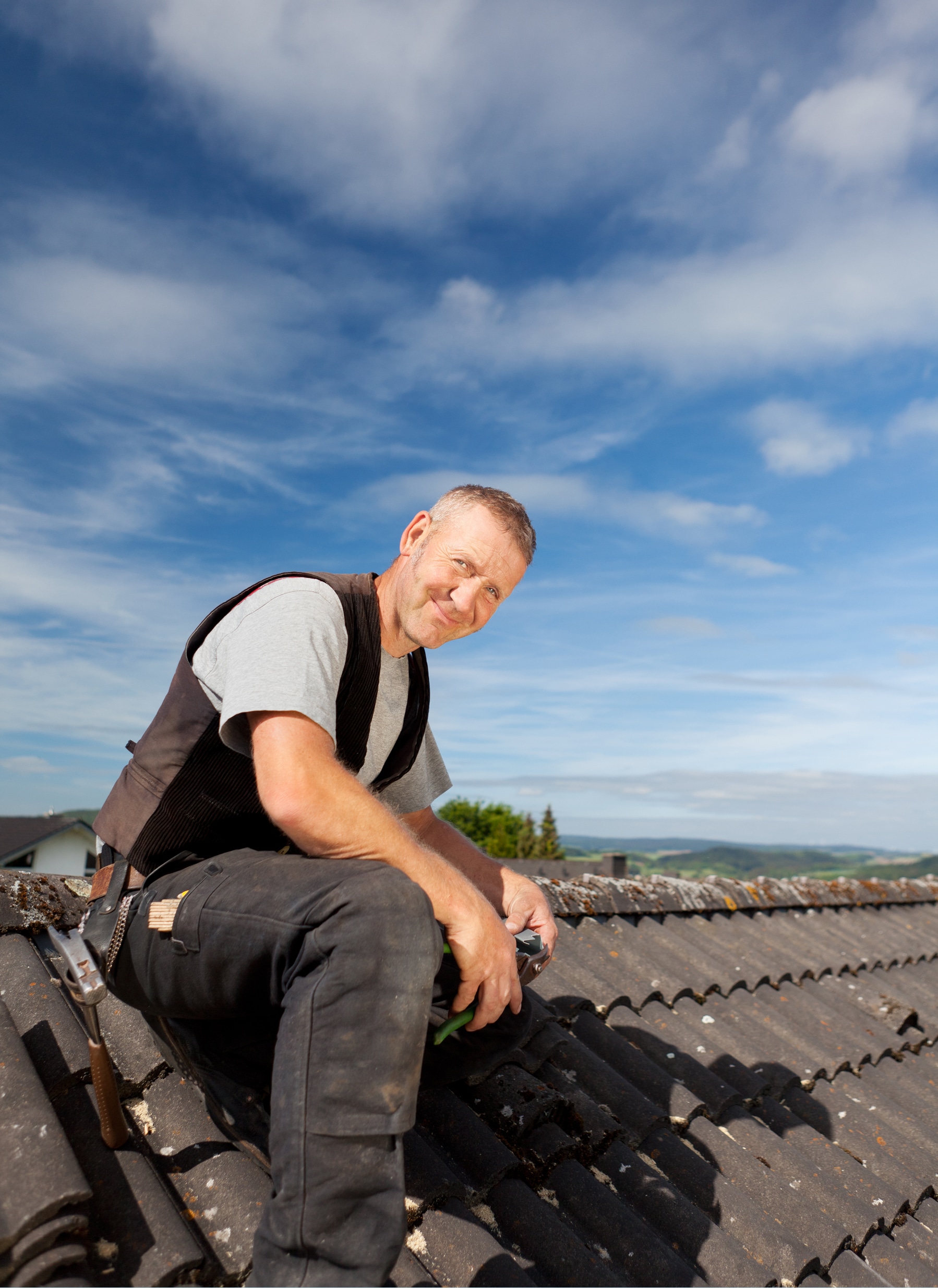 Smiling,Roofer,Sitting,On,The,Rooftop,On,A,Bright,Sunny Creative Marketing Agency